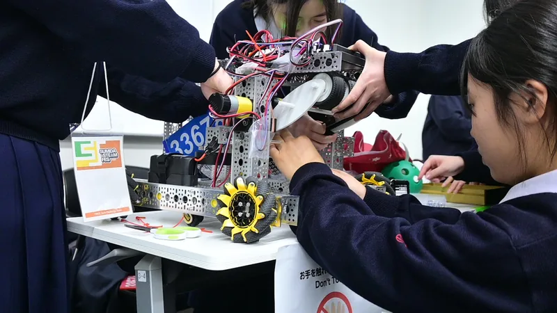 A student team adjusting an FTC robot
